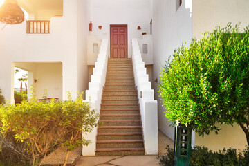 Detail of stairs and white wall of a house on the street of Egypt in Sharm El Sheikh