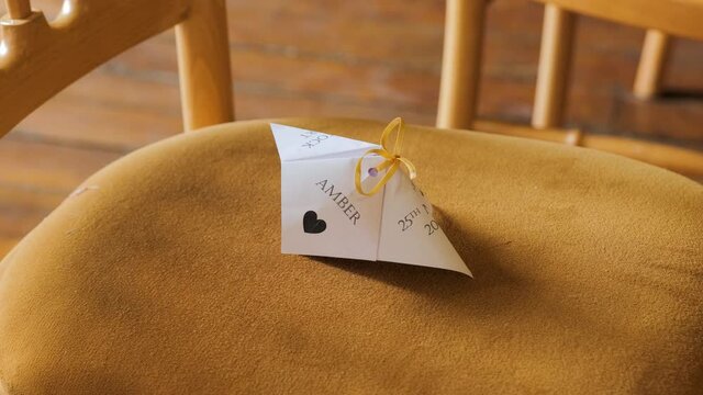 Name Card Template On A Seat In A Wedding Venue. Seating Arrangement. close up