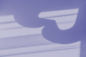 The color of the year 2022 is Very Peri blue violet gray. Creative natural abstract shadow drawing. Mockup for design, presentations, booklets. The concept of Valentine's Day. Silhouette heart