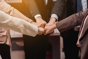 Group of business people putting their fists success for dealing,Team work to achieve goals,Hand...