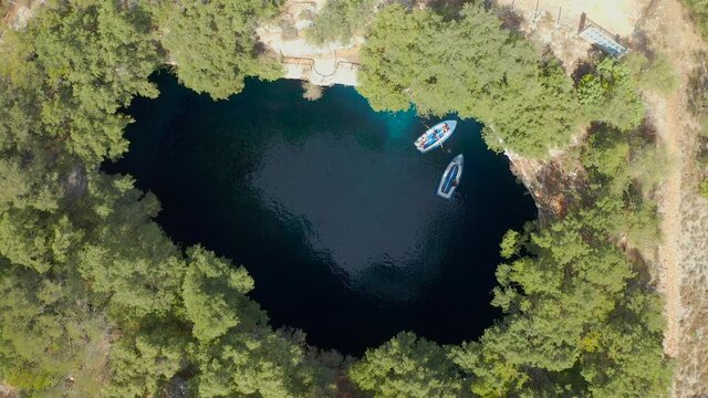 Beautiful aerial view touristic boats on famous Melissani cave, Kefalonia Island
