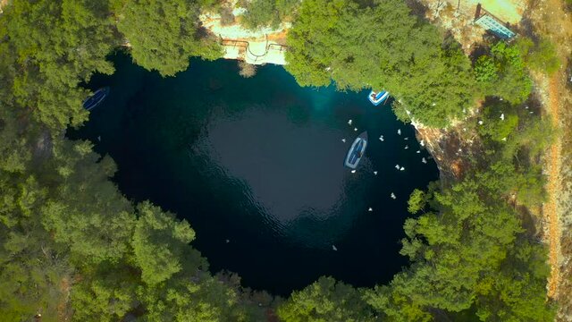 Natural phenom cave landscape, Birds flying above Melissani cave, Kefalonia Island