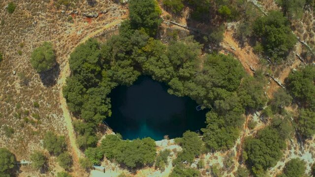 Stunning Melissani cave view from above surrounded by foliage, Natural scene