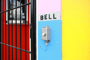 Doorbell outside of a colorful business