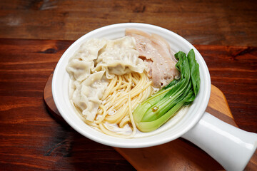 Food Homemade Asian-style pork wonton noodles, green vegetables