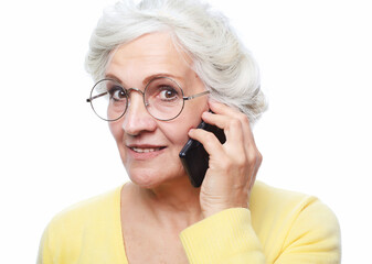 Photo of elderly woman wearin eyeglasses use smartphone over white background