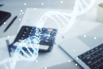 DNA hologram on calculator and pc background, biotechnology and genetic concept. Multiexposure