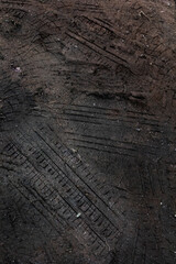 Tyre track on dirt sand or mud, retro tone, grunge tone, drive on sand, off road track