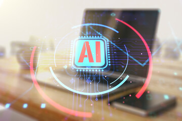 Double exposure of creative artificial Intelligence abbreviation and modern desk with computer on...