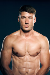 Fototapeta premium athletic male topless workout muscle bodybuilder dark background