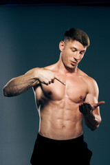 man with muscular torso workout fitness dark background