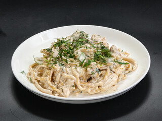 Spaghetti with cream sauce and herbs