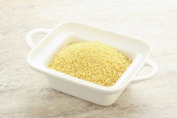Raw couscous in the bowl