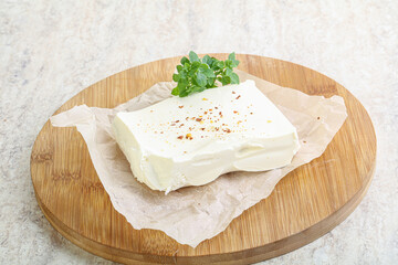 Greek Feta cheese over board