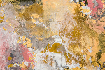 Beautiful fluid abstract paint background. Texture with gold marble pattern.