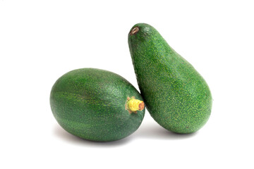 Two whole avocado isolated on white background