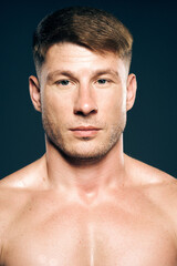 Obraz premium athletic male topless workout muscle bodybuilder dark background