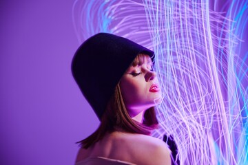Pretty young female disco neon lines dispensing fashion color background unaltered
