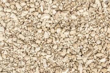 Abstract background of gravel, pebbles, shingle. Neutral colors. Black and white.