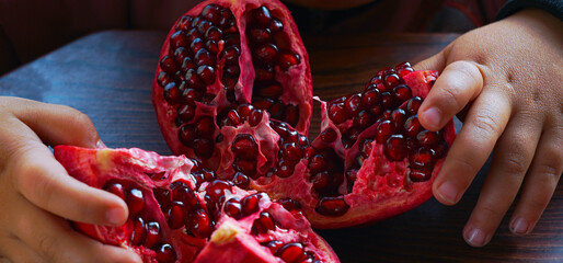 Cut the red pomegranate