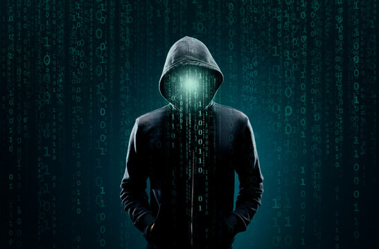 Computer hacker in hoodie. Obscured dark face. Data thief, internet fraud, darknet and cyber security concept.