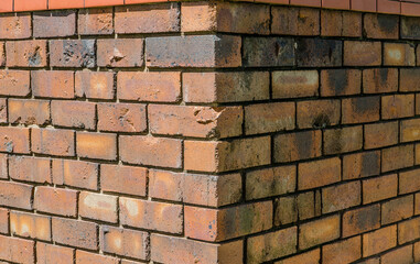 Red Brick walls corner textured surface.