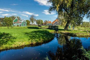 Fototapeta na wymiar Zaanse Schans, landscape with a canal and trees 