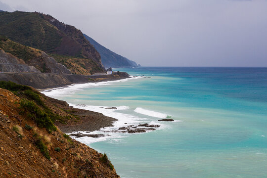 The coast of Samandag, where the Amanos mountains meet the Mediterranean Sea. The shores of Turkey's Hatay city, Samandag district. The impressive colors of the Mediterranean from green to blue.