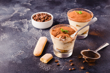 Traditional Italian dessert tiramisu in a glass.