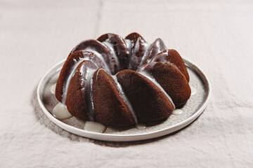 Pumpkin tangerine bundt cake with pumpkin spice and nuts for winter dinner. Selective focus