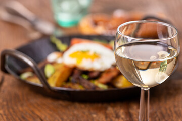 wine and tyrolean potato groestl in a pan