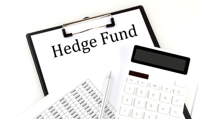 HEDGE FUND text on folder with chart and calculator on white background
