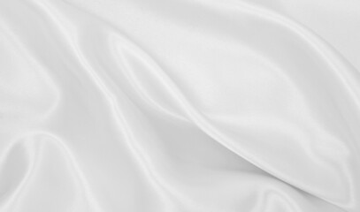 Smooth elegant white silk or satin luxury cloth texture as wedding background. Luxurious background design