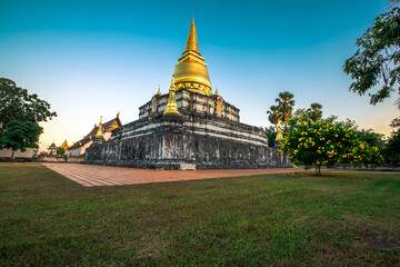 Background of important religious attractions in Thailand that are open for public viewing and making merit (Wat Phra Borommathat Thung Yang) Uttaradit) has an old chedi and a beautiful church.