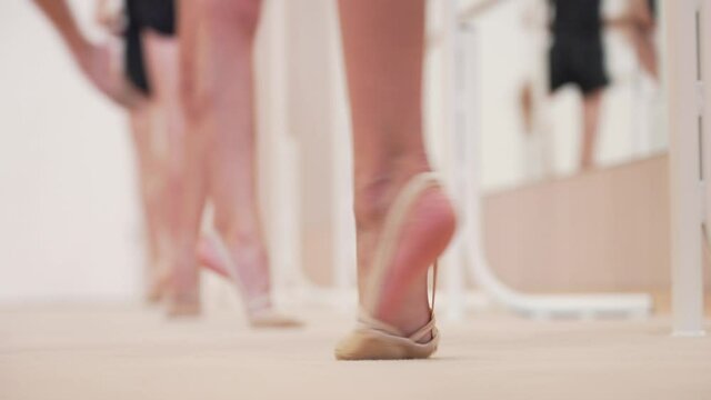 Young gymnasts perform ballet exercices during choreography training