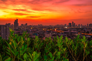 The high angle background of the city view with the secret light of the evening, blurring of night lights, showing the distribution of condominiums, dense homes in the capital community