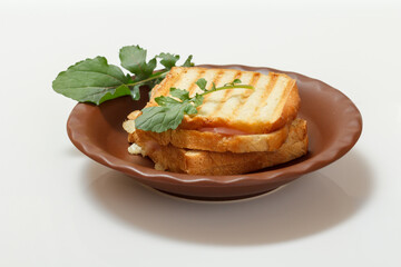 Homemade grilled cheese sandwich for breakfast on plate.