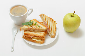 Homemade grilled cheese sandwich for breakfast with cup of coffee.