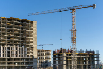 Photo of the construction site and building of high buildings and cranes in the city. Constructional concept