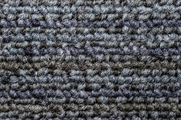 Fototapeta premium Seamless close up of monochrome grey carpet texture background from above.
