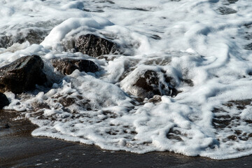 waves breaking on rocks