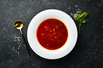 Borsch soup. Beetroot soup with sour cream, Ukrainian traditional cuisine. In a white plate. Top view.