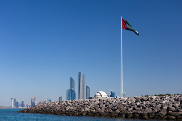 Abu Dhabi Skyline with UAE flag in United Arab Emirates