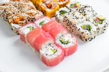 Set: sushi rolls with eel, sesame, avocado and fish. Japanese food. Top view. On a white background.