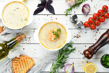 Fish soup with vegetables. Soup in a bowl. Top view. Free space for your text.