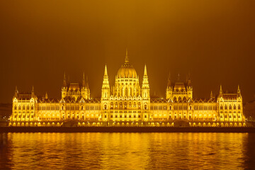 Fototapeta premium Hungarian parliament and Danube river by night in Budapest
