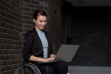 Disabled businesswoman in a wheelchair working outside