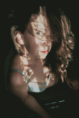 Artistic portrait of a young woman with retro shadow play style