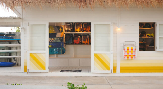 Surf store hawaiian surf boards parking rack - Powered by Adobe
