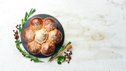 Sweet buns baked in a flower. Sweet pastries and dessert. Top view.